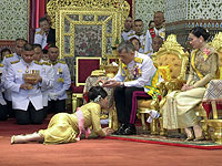 Таиланд приветствует новых короля и королеву. Фоторепортаж