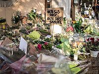 В Париже тысячи людей вышли на митинг в память об убитом учителе