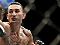 UFC в ОАЭ. Холлоуэй победил Каттара.  Емеев одолел Заваду. Итальянец уронил восходящую звезду