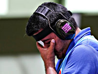 Олимпиада. Стрельба из пневматического пистолета. Победил иранец. Украинец на четвертом месте