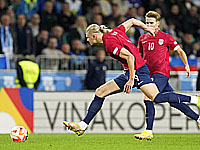 Под сильным дождем шотландцы победили сборную Грузии. Дубль Холанна