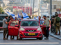 Израильтяне с государственными флагами прошли маршем по Хауаре