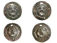 Медные пластины со львиными головами: древние погребальные аксессуары