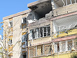 После прямого попадания ракеты в жилой дом в Кирьят-Малахи. 15 ноября 2012 года