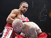 Бокс: Турман и Ньетес защитили чемпионские титулы