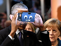 Обама и Меркель проявили интерес к современной электронике. Фоторепортаж из Ганновера