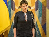 Савченко сняла с трибуны Рады свой портрет и повесила плакат с портретами других заключенных