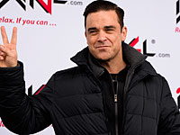 Робби Уильямс заявил о готовности представлять Россию на 